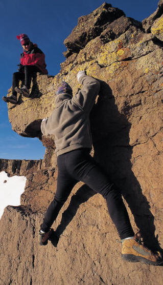 Couple rock climbing.